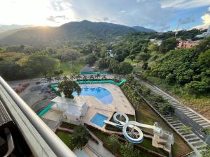 a view of a swimming pool with mountains in the background at Mountain View Pool & Slide AC 5min to Town in Santa Fe de Antioquia