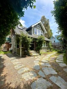 a house with a stone walkway in front of it at Oasis Hollywood in Los Angeles