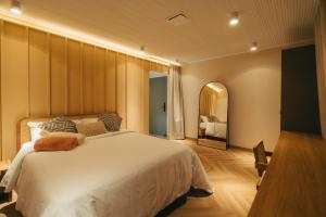 Postel nebo postele na pokoji v ubytování Hotel Boutique Roomzz Laureles