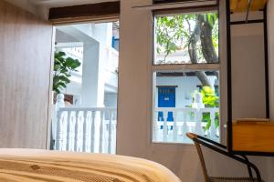 Ένα ή περισσότερα κρεβάτια σε δωμάτιο στο Casa Helena Hostel