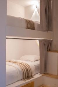 Ένα ή περισσότερα κρεβάτια σε δωμάτιο στο Casa Helena Hostel