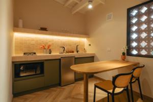Kuchyň nebo kuchyňský kout v ubytování Hotel Boutique Roomzz Laureles