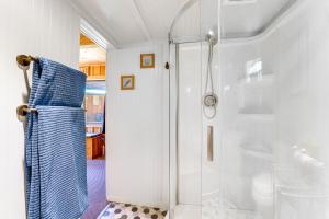a shower with a glass door in a bathroom at Cabin on 5 Acres in Port Angeles with Fire Pit! in Port Angeles +16 photos