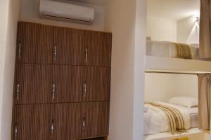 Ένα ή περισσότερα κρεβάτια σε δωμάτιο στο Casa Helena Hostel