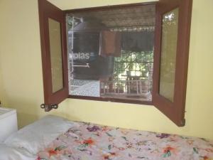 Ένα ή περισσότερα κρεβάτια σε δωμάτιο στο Casa de Douglas