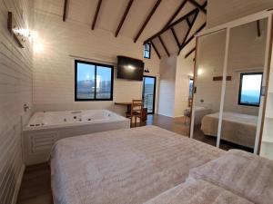 Foto dalla galleria di Cabana com Banheira Hidromassagem e Piso Aquecido a Urupema