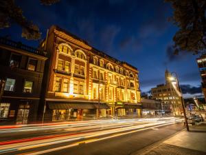 a building on a city street at night at Hadley's Orient Hotel in Hobart +58 photos