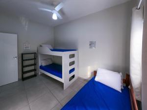 Ένα ή περισσότερα κρεβάτια σε δωμάτιο στο Aconchego e Descanso na PG