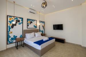 Postel nebo postele na pokoji v ubytování Golden 4BR Villas by Travelholic + 37 fotografií
