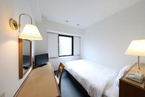 Postel nebo postele na pokoji v ubytování Smile Hotel Nihombashi Mitsukoshimae + 18 fotografií