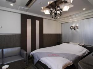 Postel nebo postele na pokoji v ubytování ホテルレジェンドプラス-Adult only