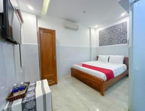 Postel nebo postele na pokoji v ubytování Tây Nguyên Hotel Đà Nẵng + 18 fotografií
