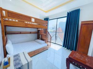 Voodi või voodid majutusasutuse Tây Nguyên Hotel Đà Nẵng toas