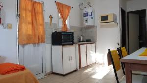 a small kitchen with a microwave on a counter at 17-Solar Chaja in Chajarí