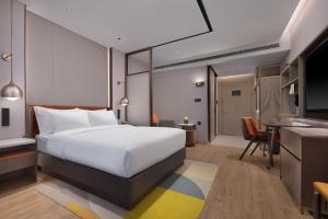 Katil atau katil-katil dalam bilik di Home2 by Suite Wuhan Qingshan