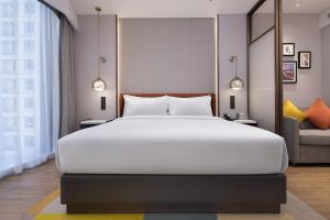 Katil atau katil-katil dalam bilik di Home2 by Suite Wuhan Qingshan