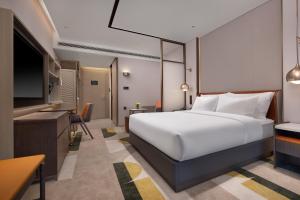 Katil atau katil-katil dalam bilik di Home2 by Suite Wuhan Qingshan