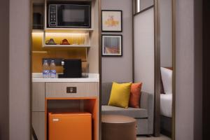 Ruang duduk di Home2 by Suite Wuhan Qingshan
