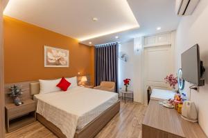 Postel nebo postele na pokoji v ubytování Moon Hotel 2 Đỗ Quang