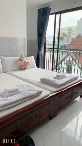 Voodi või voodid majutusasutuse Tây Nguyên Hotel Đà Nẵng toas