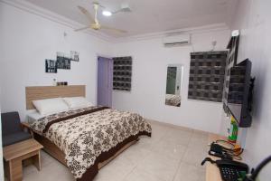 Postel nebo postele na pokoji v ubytování AGh international Serviced Apartments