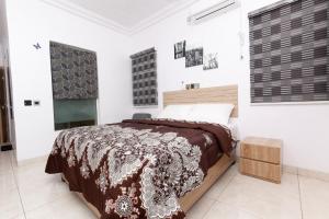 Postel nebo postele na pokoji v ubytování AGh international Serviced Apartments