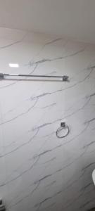 a white marble floor with two tongs on it at Yala Reach Hotel in Tissamaharama +39 photos