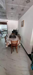 a table and chairs in a room with a table at Yala Reach Hotel in Tissamaharama