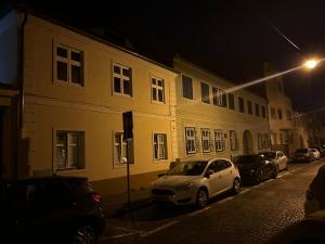 a car parked on a street next to a building at 4CENTER Apartments in Sibiu