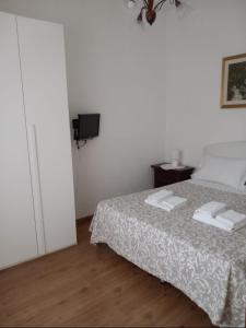 Postel nebo postele na pokoji v ubytování B&B A casa di Antonella