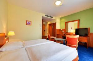 Voodi või voodid majutusasutuse Hotel Filipinum toas
