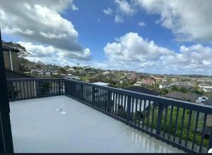 a balcony with a view of a city at 北岸小屋 in Auckland