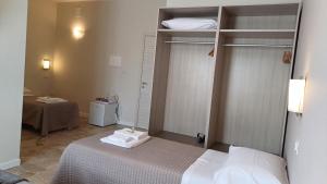 a bedroom with a bed and a room with a table at B&B Monté in Montesilvano