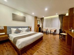 Ένα ή περισσότερα κρεβάτια σε δωμάτιο στο Voyage The Royal Retreat