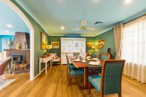 a dining room with a table and a fireplace at Baulkham Hills 4br luxury house in Baulkham Hills