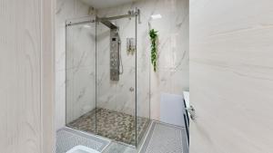 a shower with a glass door in a bathroom at B&B Luxury House Rho in Rho +32 photos