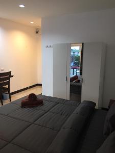 a bedroom with a large bed and a dining room at Smart Place Pattaya in Pattaya +55 photos