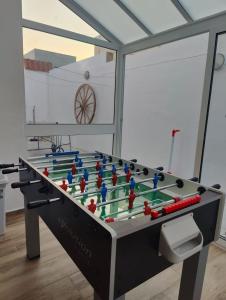 a large foosball table in a room at Location, Location, Location in St. Julianʼs +5 photos