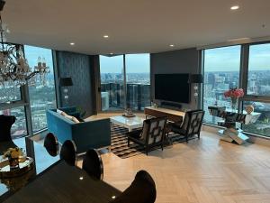 a living room with a view of a city at Premium Luxury Sub-Penthouse in Melbourne