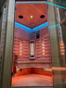 an empty stage with blue lights in a building at Bed & Breakfast Zeeduinsepoort met Sauna in Oostkapelle