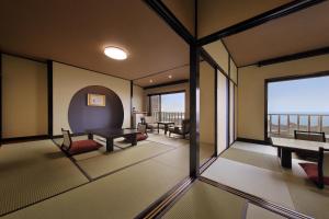 Uma cama ou camas num quarto em 季粋の宿 紋屋