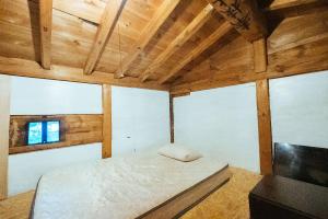 Postel nebo postele na pokoji v ubytování hinatabocco guesthouse