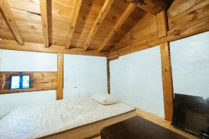 Postel nebo postele na pokoji v ubytování hinatabocco guesthouse