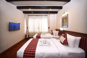 Skye Inn Kathmandu客房内的一张或多张床位
