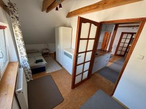 Posteľ alebo postele v izbe v ubytovaní Apartament na poddaszu