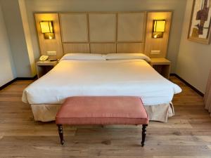 Łóżko lub łóżka w pokoju w obiekcie Hotel Isla de La Garena