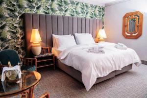 Postel nebo postele na pokoji v ubytování Eventhotel Pyramide