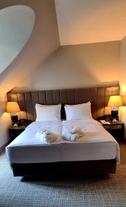 Postel nebo postele na pokoji v ubytování Eventhotel Pyramide