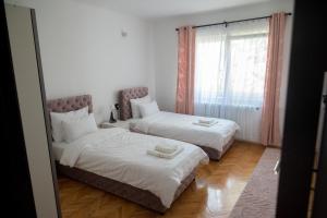 Letto o letti in una camera di M2-apartments