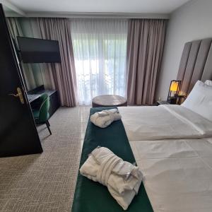 Postel nebo postele na pokoji v ubytování Eventhotel Pyramide